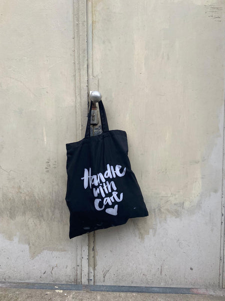 HANDLE WITH CARE BAG